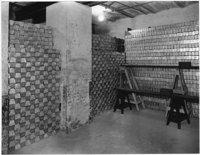 Photograph of a vault with gold bars. Bullion marking problems: 10 common errors and fixes