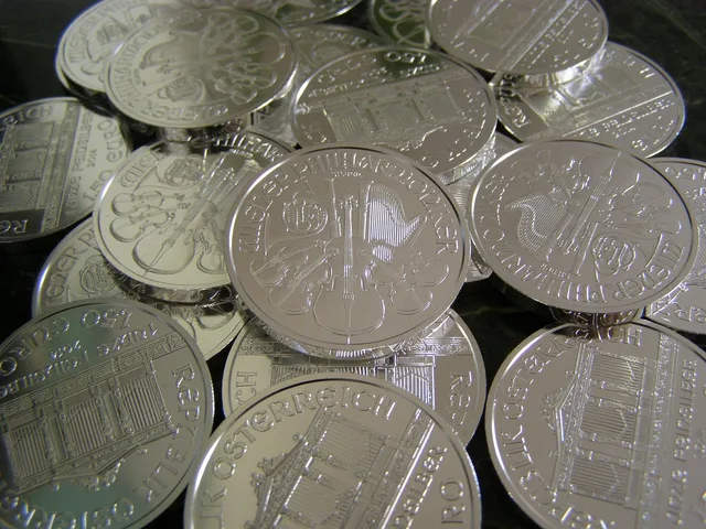 money, coins, silver, metallic, investment, wealth. Building and selling a small silver position case