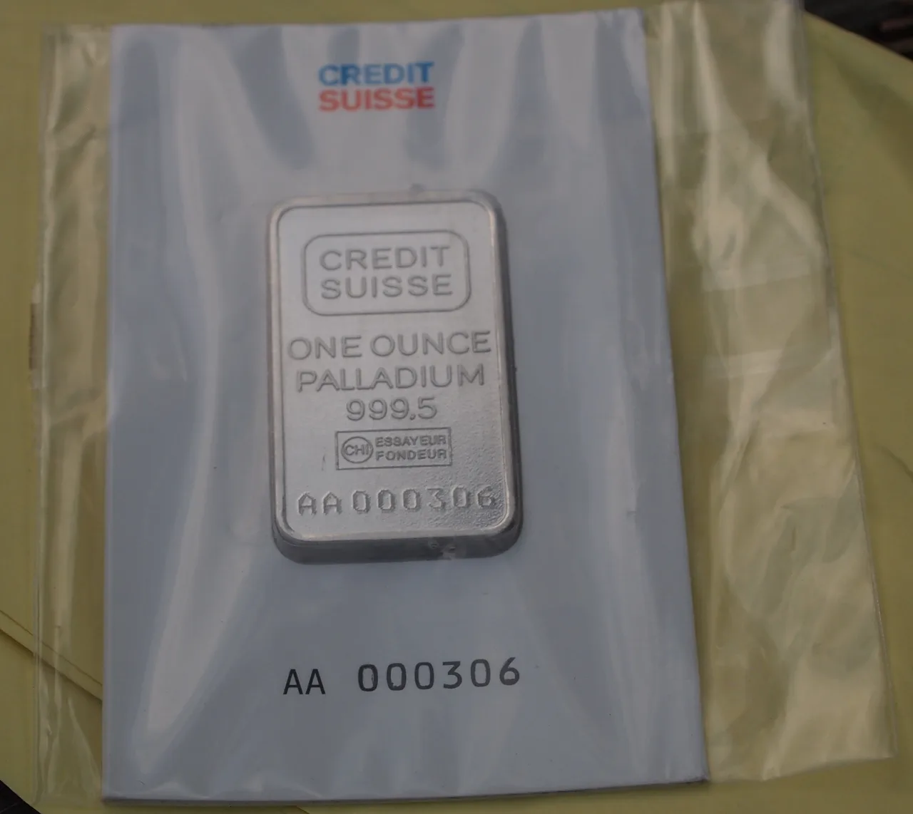 A one-ounce 999.5 palladium bar in serialized packaging